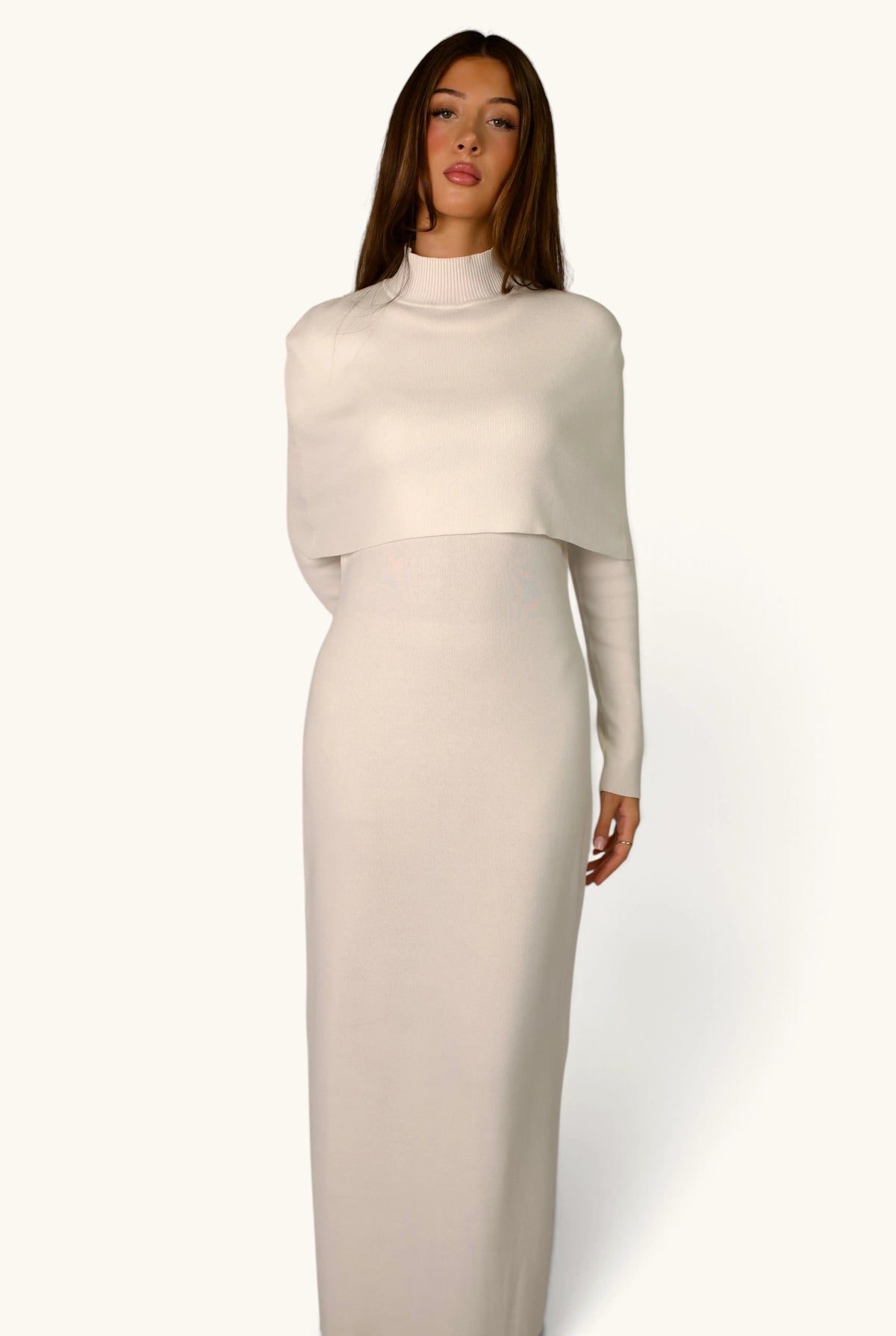 Gebreide jurk met cape-detail